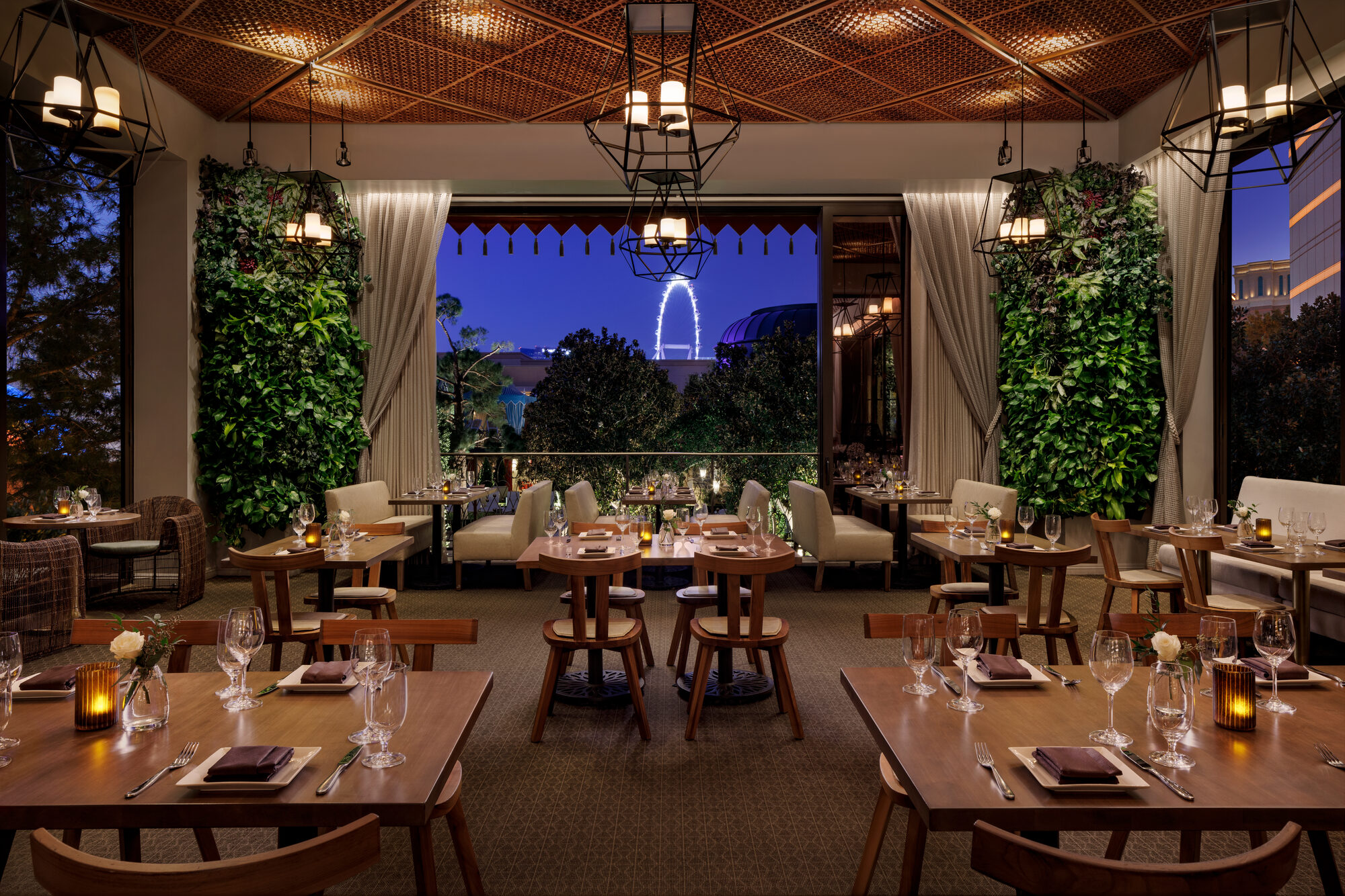La Cave garden room at dusk overlooking the Wynn gardens